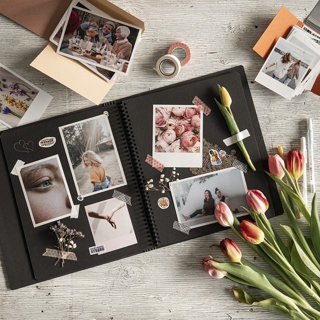 Photo album with many pictures, next to tulips